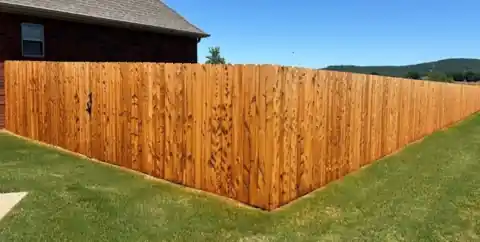 Eastern cedar fence run stained in Cedar Tone