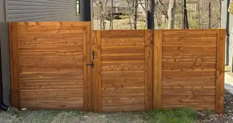 Horizontal eastern cedar gate stained in Desert Sand